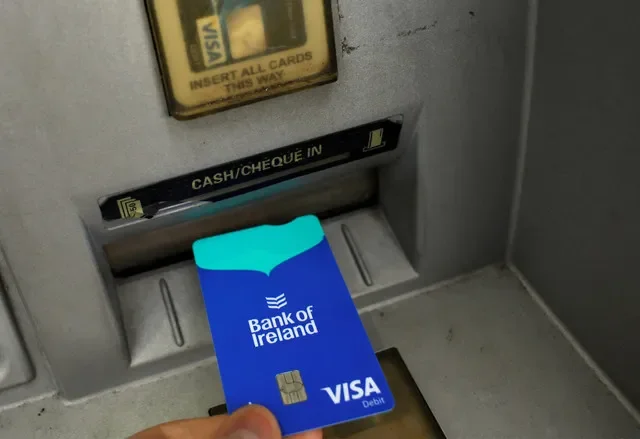 A customer uses an automated teller machine at a Bank of Ireland branch located in Newbridge, Ireland, as seen in this August 2023 file photo. REUTERS/Clodagh Kilcoyne/File Photo