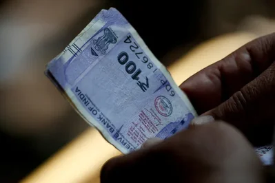 Rupee Recovers from Record Low After RBI Intervention