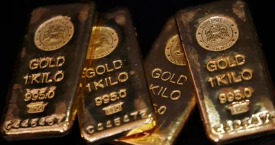 Gold edges up on Friday but heads for weekly decline