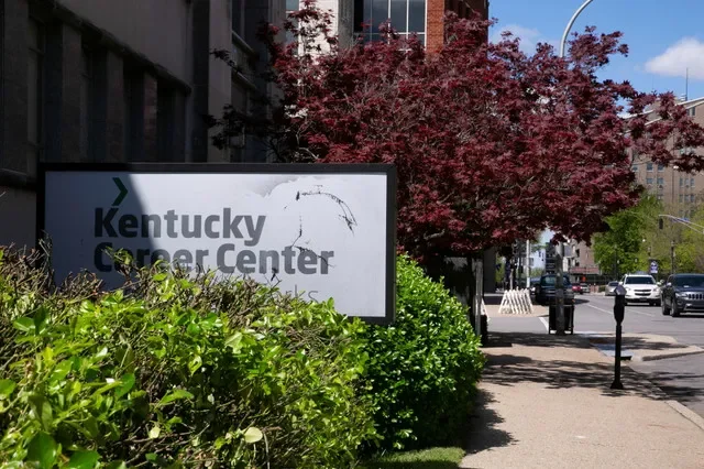 A sign for a career center in Louisville, Kentucky, marks the reopening of regional facilities for unemployment services. REUTERS/Amira Karaoud