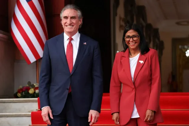 Interim President Delcy Rodriguez and U.S. Interior Secretary Doug Burgum stand together to deliver statements at Miraflores Palace in Caracas, Venezuela. REUTERS/Leonardo Fernandez Viloria