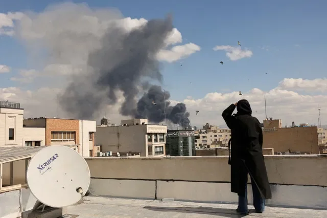 Plumes of smoke ascend over the skyline of Tehran following a reported blast on March 1. Photo by Majid Asgaripour/WANA