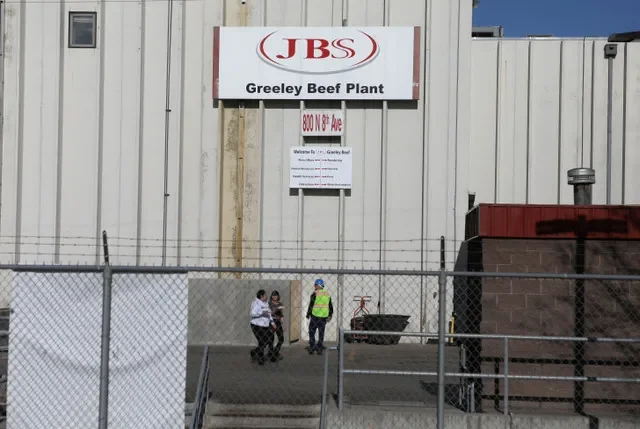 A file photo showing staff members at the JBS USA beef processing facility located in Greeley, Colorado. Photo credit: REUTERS/Jim Urquhart/File Photo