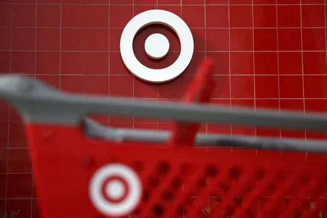 A Target shopping cart is seen in front of a company logo at a store in Azusa, California, on November 16, 2017. REUTERS/Lucy Nicholson/File Photo