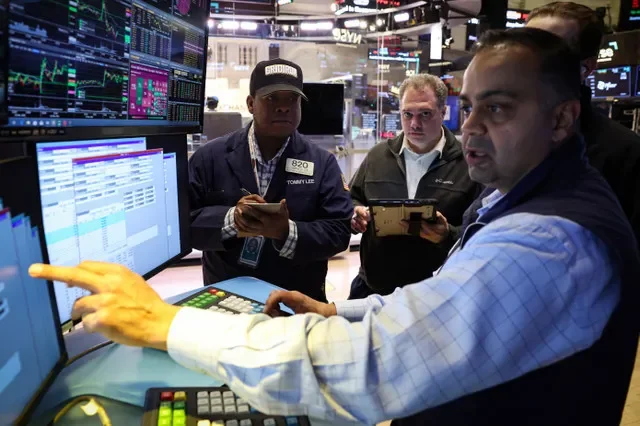 Floor traders at the New York Stock Exchange (NYSE) conduct business in New York City on March 5, 2026. REUTERS/Brendan McDermid