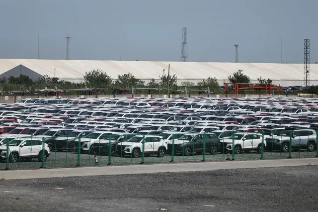 New vehicles parked at a storage facility in Shanghai, China, during September 2025. REUTERS/Go Nakamura