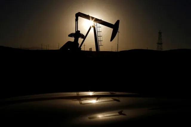 A pump jack is silhouetted against the sunrise near Bakersfield, California, in this file photo. REUTERS/Lucy Nicholson/File Photo/File Photo