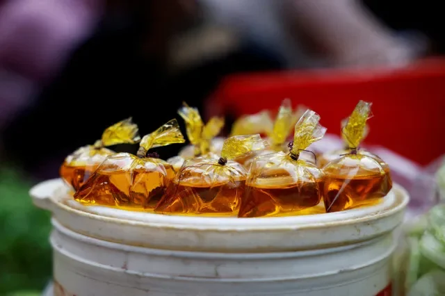 Packets of edible oil displayed in Dhaka, Bangladesh, on March 24, 2023, as captured by Mohammad Ponir Hossain for Reuters.
