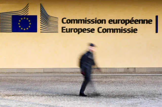 A pedestrian passes the European Commission headquarters building located in Brussels, Belgium. REUTERS/Yves Herman/File Photo