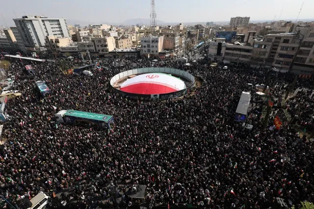 People gather for the funeral of Iranian security chief Ali Larijani and victims of the IRIS Dena warship at Enghelab Square, amid the U.S.-Israeli conflict with Iran, in Tehran, Iran, March 18, 2026. REUTERS/Alaa Al Marjani