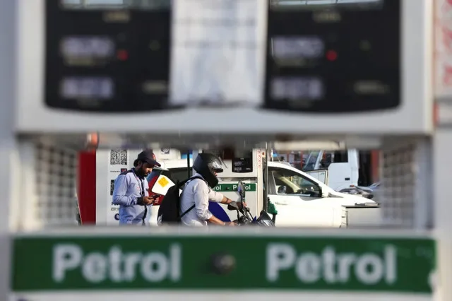 A motorcyclist departs from a petrol station after filling up in New Delhi, India, during the ongoing energy supply challenges in March 2026. REUTERS/Bhawika Chhabra