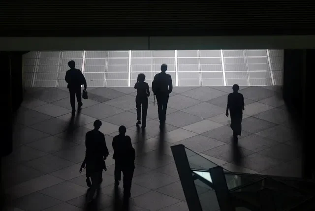 Pedestrians walk through a convention hall in Tokyo, Japan, on May 15, 2025. REUTERS/Issei Kato