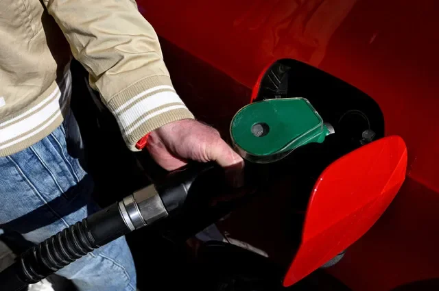 A motorist fills his tank at a Dalioil gas station in Dubnica nad Vahom, Slovakia, on March 18, 2026. REUTERS/Radovan Stoklasa/File Photo