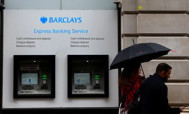 Pedestrians pass by a Barclays Bank branch located in London, Britain, on March 17, 2023. REUTERS/Peter Nicholls
