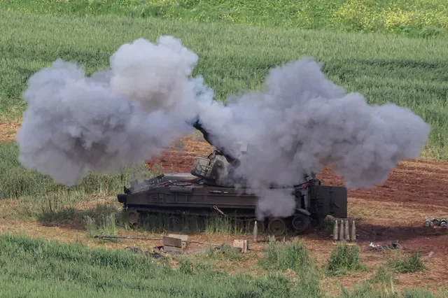 Israeli artillery personnel operate near the Lebanese border during a period of heightened regional tension involving Hezbollah and Iranian interests, as captured on March 26, 2026. REUTERS/Tyrone Siu