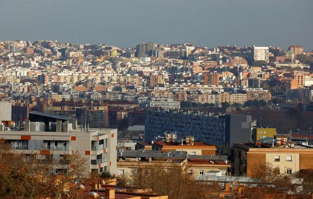 A wide-angle view showing the dense urban landscape of Barcelona and Santa Coloma de Gramanet, captured in January 2025. REUTERS/ Albert Gea
