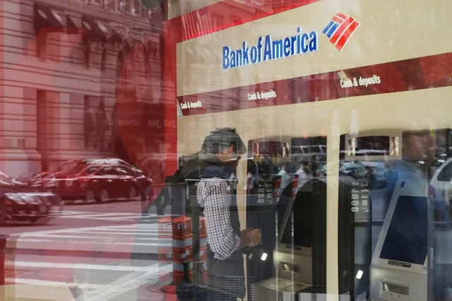 A customer is seen using an automated teller machine at a Bank of America location in Boston, Massachusetts, in this file photo from October 2017. REUTERS/Brian Snyder/File Photo