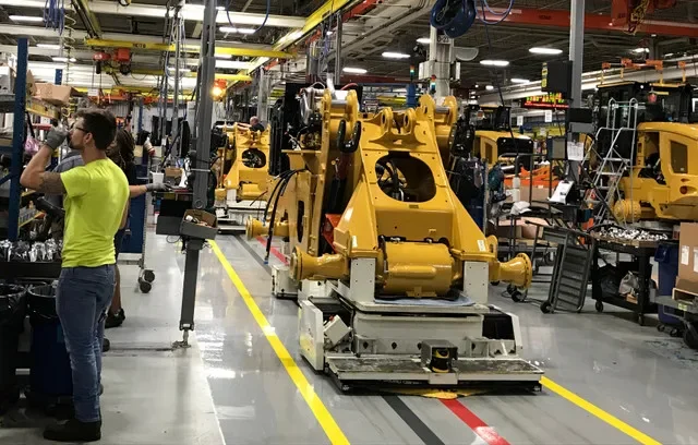 Staff members operating at the Caterpillar assembly facility for small wheel loaders in Clayton, North Carolina, photographed in August 2018. REUTERS/Rajesh Singh