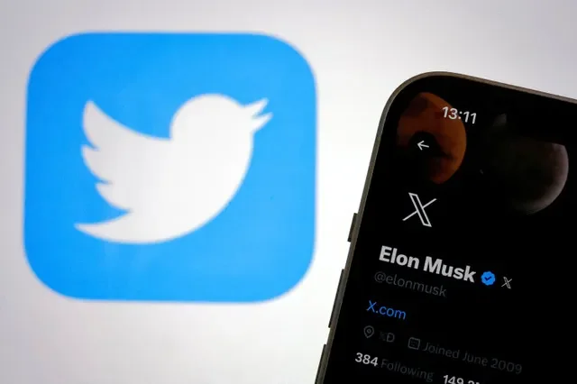 The rebranding of Twitter to X is shown on a smartphone and laptop screen in July 2023. REUTERS/Clodagh Kilcoyne/File Photo