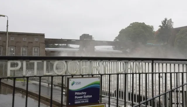 A controlled release of water flows over the SSE Hydro Dam located in Pitlochry, Scotland, as seen on October 8, 2023. REUTERS/Russell Cheyne