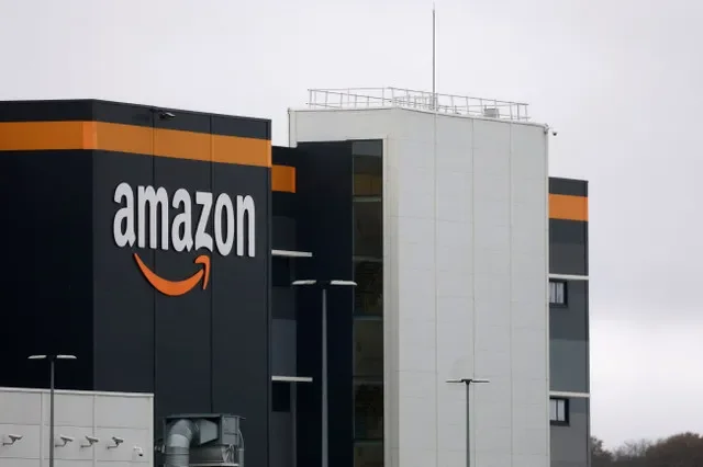 An Amazon corporate logo is pictured at a logistics hub in Bretigny-sur-Orge, France, on November 28, 2025. REUTERS/Stephanie Lecocq