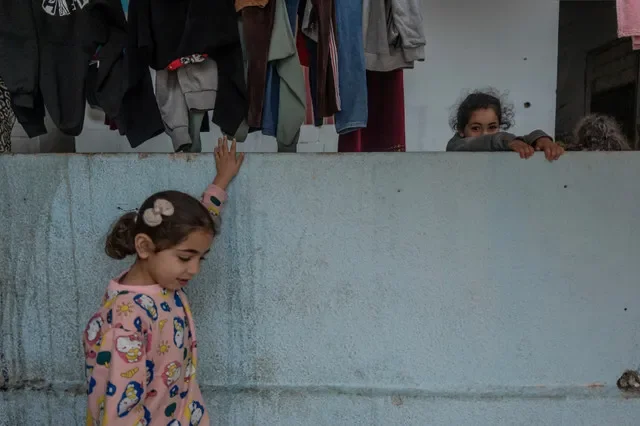 Displaced children play at a temporary shelter in Sidon, Lebanon, as regional hostilities escalate on April 1, 2026. REUTERS/Manu Brabo