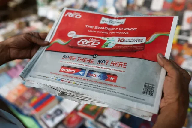 A newspaper display in New Delhi features a "Made in India" advertisement by Dabur India Limited. REUTERS/Anushree Fadnavis