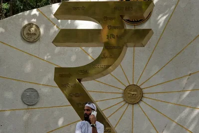 RBI currency curbs shield rupee from offshore volatility