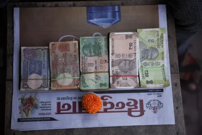 Indian Rupee Edges Higher Ahead of RBI Policy Deadline