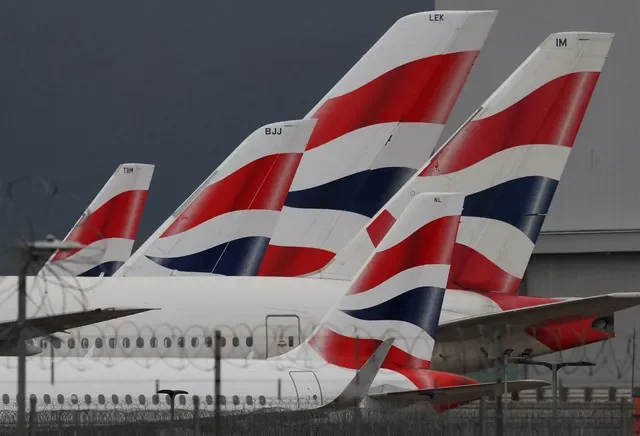A row of British Airways aircraft displaying the company livery sits on the tarmac at London Heathrow Airport in early 2025. REUTERS/Toby Melville/File Photo