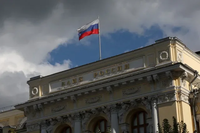 The Russian national flag is seen waving over the Central Bank of Russia's main office in Moscow during a clear day in late 2025. REUTERS/Ramil Sitdikov