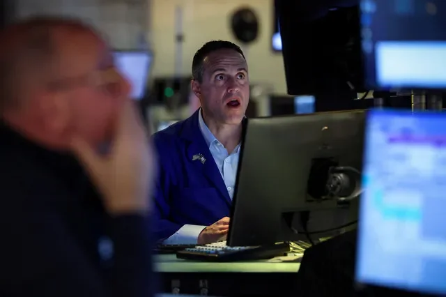 Traders manage floor operations at the New York Stock Exchange during a busy session in April 2026. REUTERS/Brendan McDermid