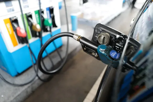 A fuel pump nozzle at a PTT station in Bangkok, Thailand, captured during a period of regional geopolitical tension in March 2026. REUTERS/Athit Perawongmetha