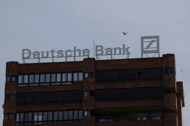 A Deutsche Bank logo is pictured on the roof of a building above a branch office in Malaga, Spain, on April 24, 2024. REUTERS/Jon Nazca