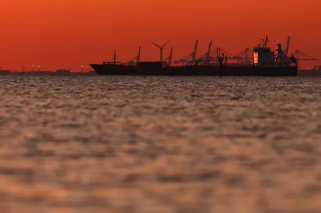 The silhouette of an oil and chemical tanker off the Gulf of Fos-sur-Mer at sunset, in Martigues, France, March 20, 2026. REUTERS/Manon Cruz