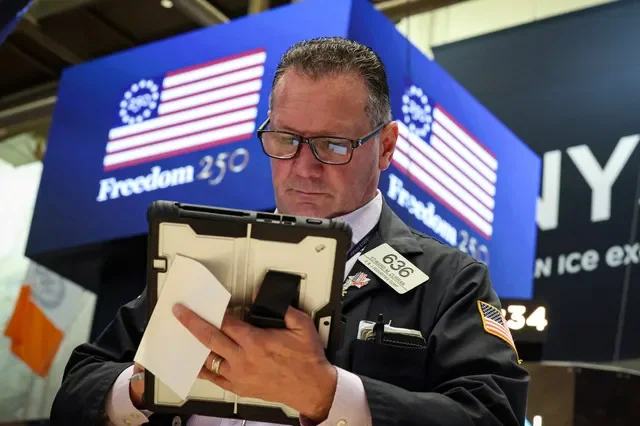 A financial professional monitors market activity on the floor of the New York Stock Exchange on April 20, 2026. REUTERS/Brendan McDermid