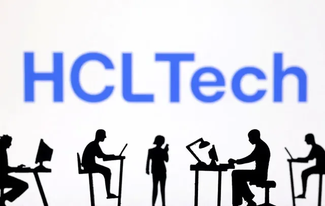 Miniature figurines representing technology users are positioned near the HCLTech corporate logo. REUTERS/Dado Ruvic/Illustration