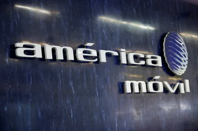 The corporate logo of America Movil displayed at the company's reception desk in Mexico City. REUTERS/Gustavo Graf