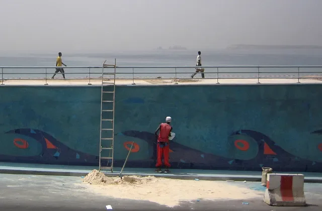 Maintenance crews are seen painting the entrance of a Dakar underpass in early 2008. REUTERS/Normand Blouin/File Photo