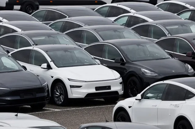 A row of Tesla electric vehicles parked at a distribution facility in Valenton, France, during a 2025 delivery cycle. REUTERS/Benoit Tessier/File Photo