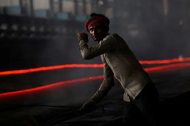 A laborer works on a steel production line in Mandi Gobindgarh, Punjab, India, during August 2025. REUTERS/Bhawika Chhabra//File Photo