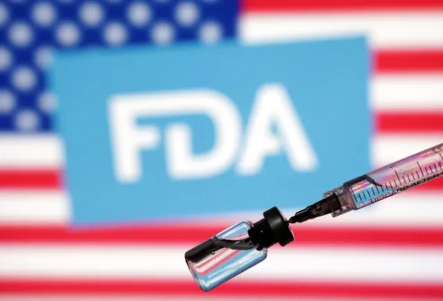An illustration featuring the U.S. flag, the FDA logo, a medical syringe, and a drug vial, captured in May 2025. REUTERS/Dado Ruvic/Illustration