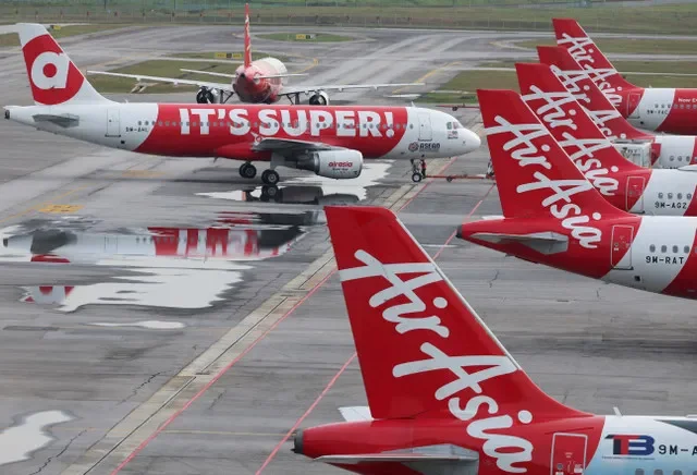 A row of AirAsia aircraft parked at the Kuala Lumpur International Airport Terminal 2 in Malaysia. REUTERS/Hasnoor Hussain/File Photo