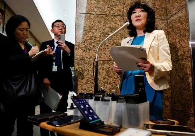 Japanese Finance Minister Satsuki Katayama addresses the press in Tokyo following a multi-agency meeting regarding financial stability and cybersecurity concerns on April 21, 2026. REUTERS/Kim Kyung-Hoon