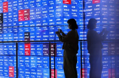 Asian Markets Slip on Iran Tensions and AI Growth Worries