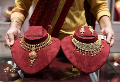 Gold falls as hot US inflation data trims rate cut bets