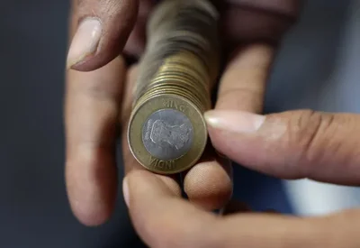 Indian Rupee Hits Record Low of 95.8525 Against Dollar