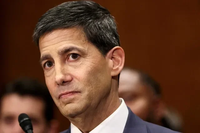 FILE PHOTO: Kevin Warsh, U.S. President Donald Trump's nominee to be next chair of the Federal Reserve, testifies before a Senate Banking Committee confirmation hearing on Capitol Hill in Washington, D.C., U.S., April 21, 2026. REUTERS/Kevin Lamarque/File Photo
