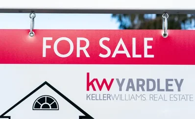 The real estate market in Bucks County is experiencing a late spring surge with buyers returning to the market despite global economic uncertainty. Median sale prices reached $510,000 in April as high demand for school districts drives competitive bidding and offers above asking prices.
