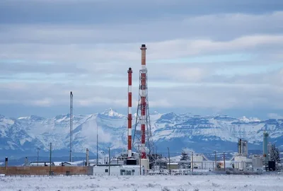 Alberta is leveraging its abundant natural gas reserves and cooler climate to attract tech giants for AI data center expansion. This strategy challenges federal plans to power the sector with clean energy while offering a new market for regional gas producers facing supply gluts.